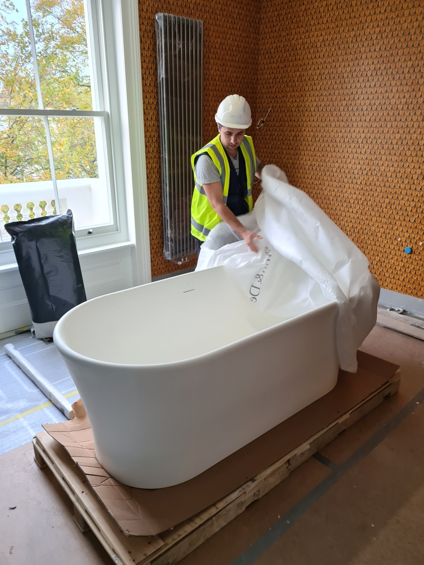 Professional plumber inspecting bathroom